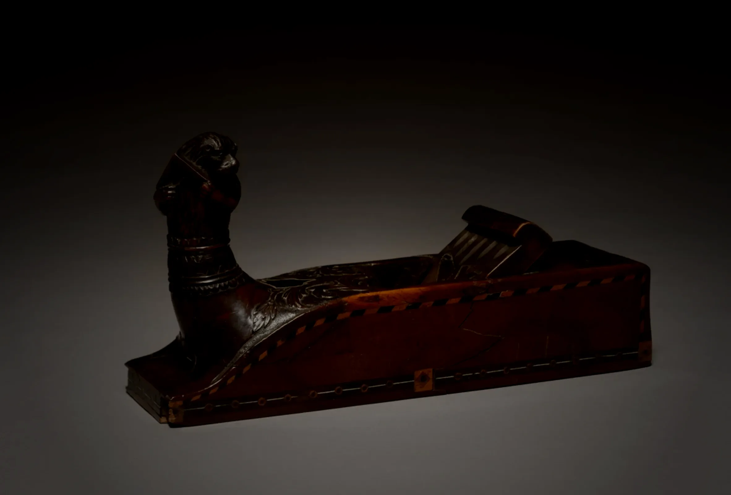 A carpenter's plane, worn smooth with use